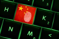 Fingerprint on a Chinese key on a keyboard to denote cyber crime