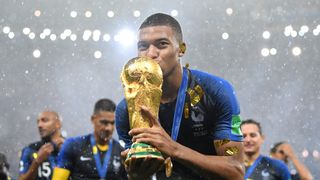 Kylian Mbappe kisses the World Cup after France's 2018 triumph