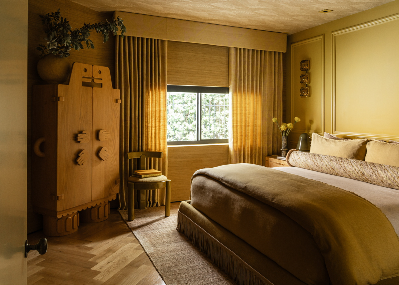 a yellow bedroom with a unique freestanding wardrobe and details