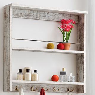 Home & Haus Fennel Two-Shelf Display Unit with brass hooks against white wall