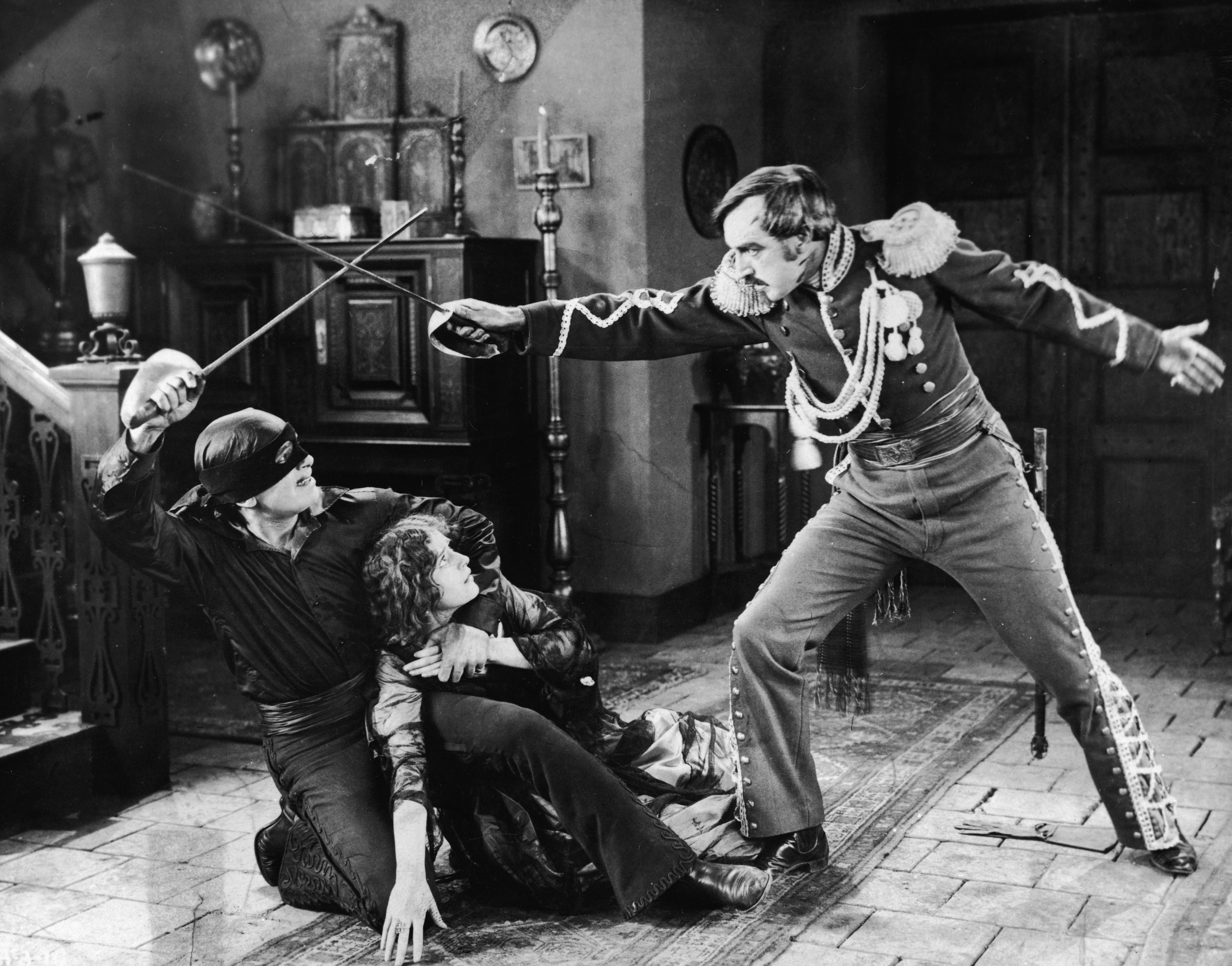 Actor Douglas Fairbanks duelling Robert McKim in the film 'The Mark of Zorro' (1920)