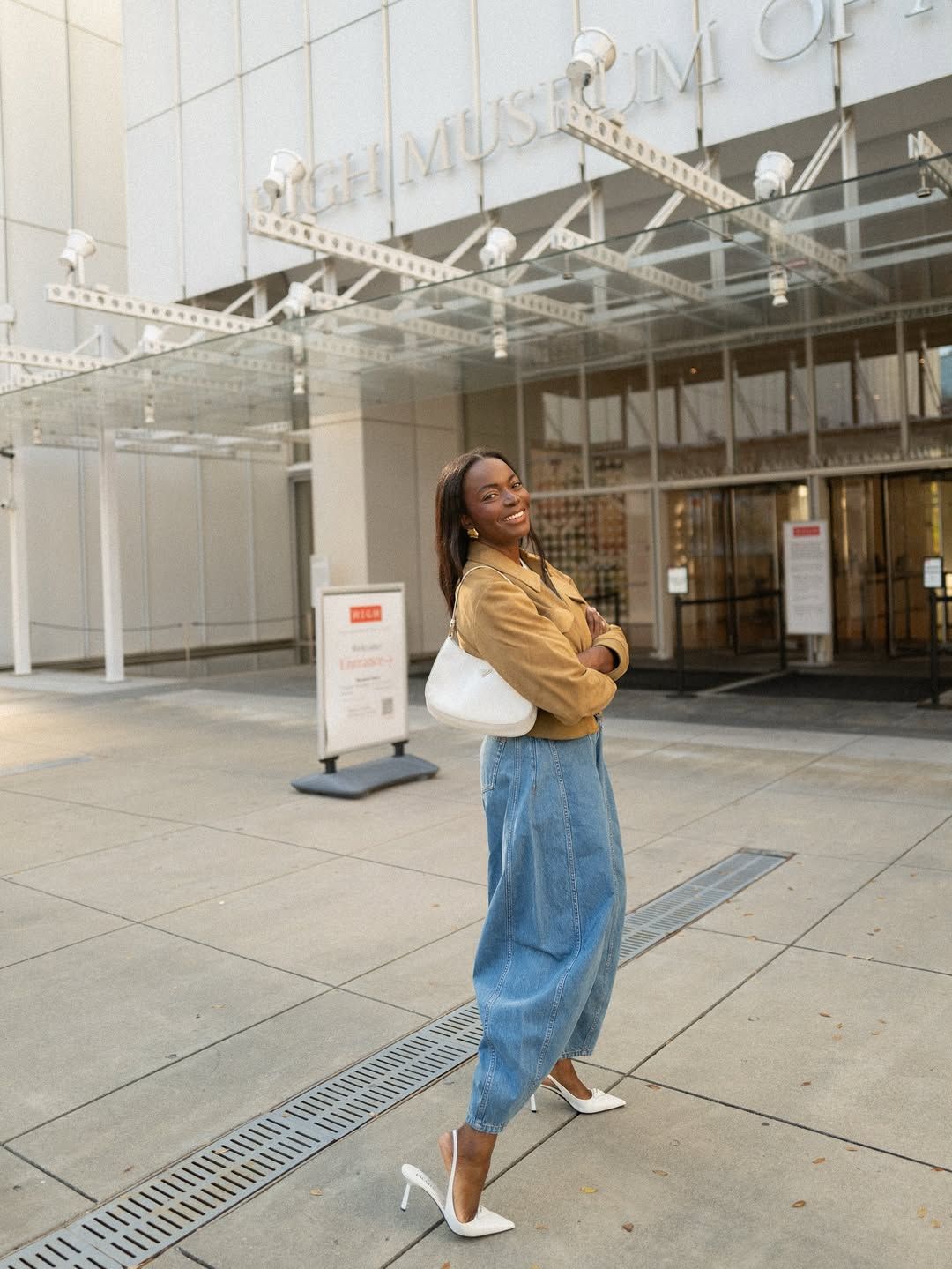 Coco Bassey in light wash jeans