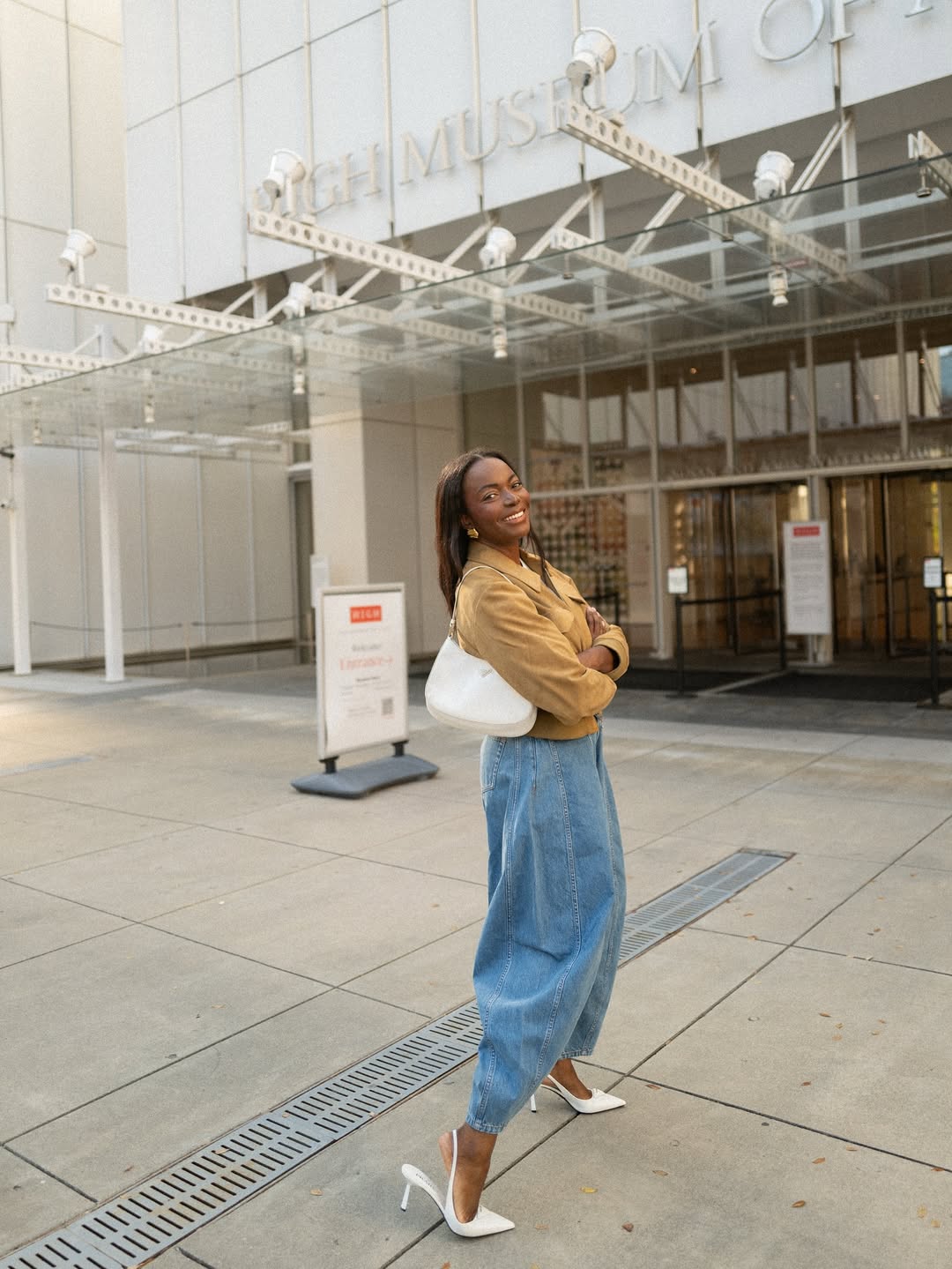 Coco Bassey in light wash jeans