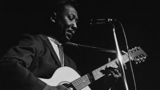 Muddy Waters playing the guitar