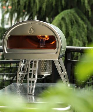 green colored portable pizza oven