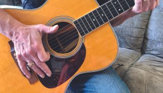 Jimmy Leslie demonstrates the fingerstyle slap technique on an acoustic guitar