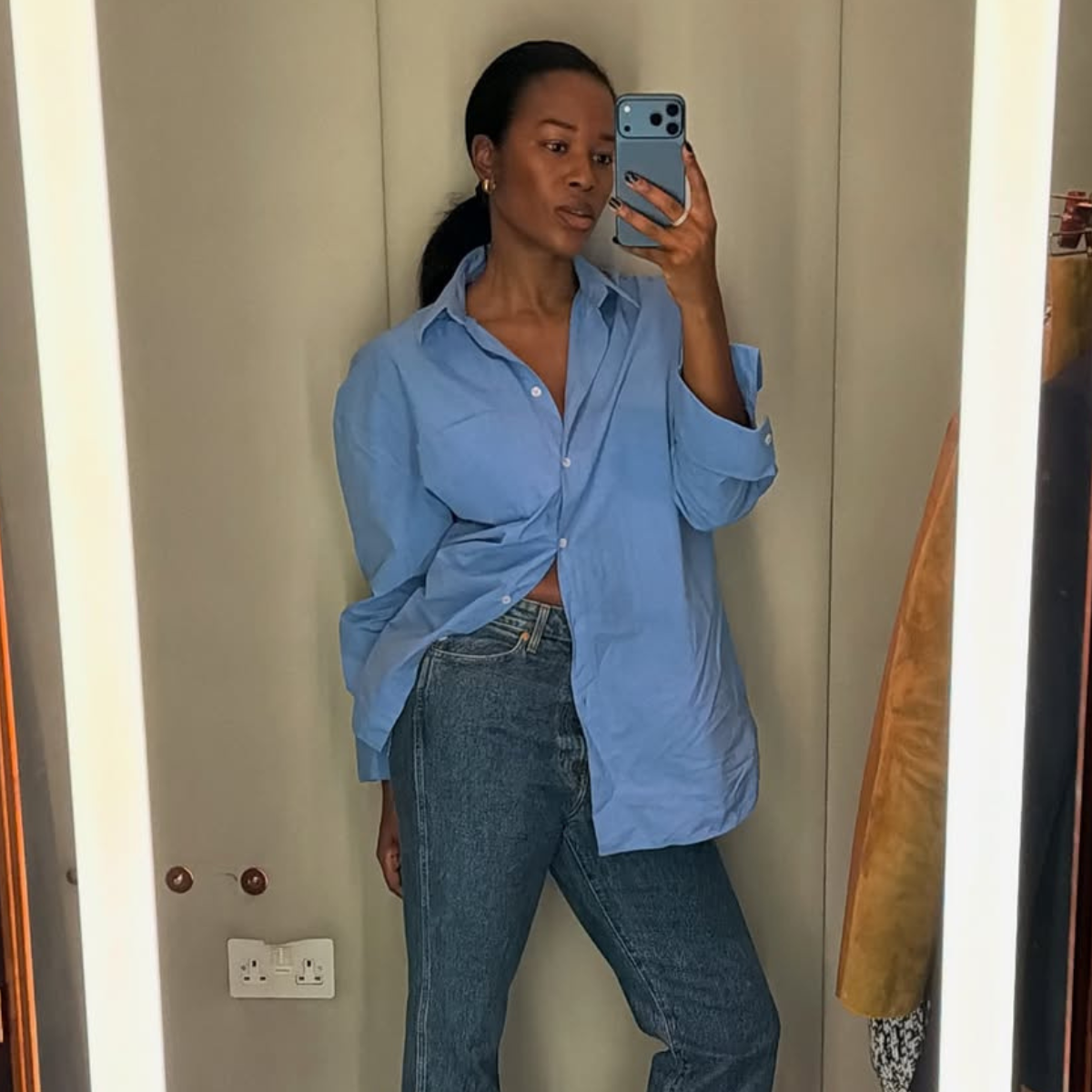 woman wearing heels with jeans spring outfit 2026