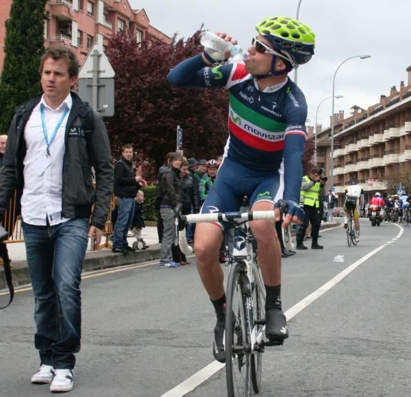 Race winner Giovanni Visconti grabs a drink of water.