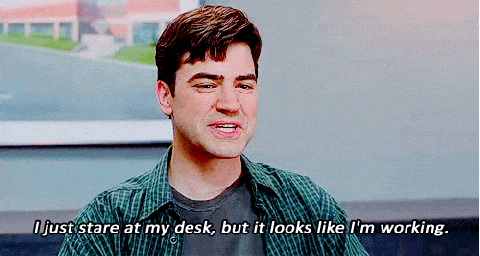 Gif with man saying 'I just stare at my desk'