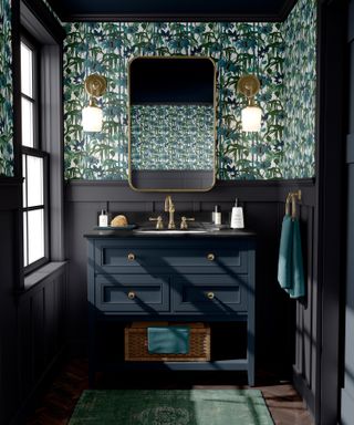 downstairs bathroom with mirror and wallpaper