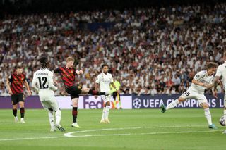 Kevin De Bruyne of Manchester City scores the team's first goal during the UEFA Champions League semi-final first leg match between Real Madrid and Manchester City FC at Estadio Santiago Bernabeu on May 09, 2023 in Madrid, Spain. (Photo by Julian Finney/Getty Images)