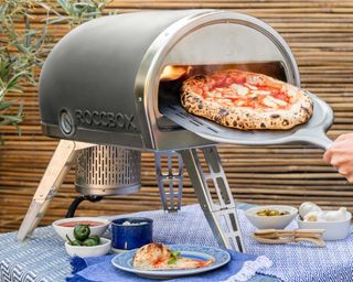 cooking a pizza in a gas fired pizza oven