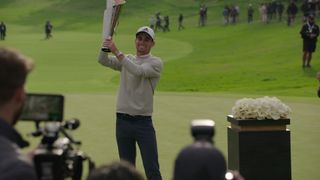 Joaquin Niemann holding a trophy in Full Swing