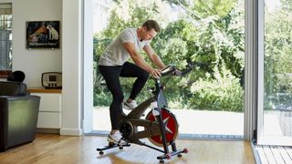 Man using one of the best exercise bikes for home