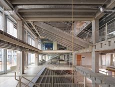 the raw concrete shell of thoravej29 by pihlmann architects as part of the copenhagen architecture biennial 2025