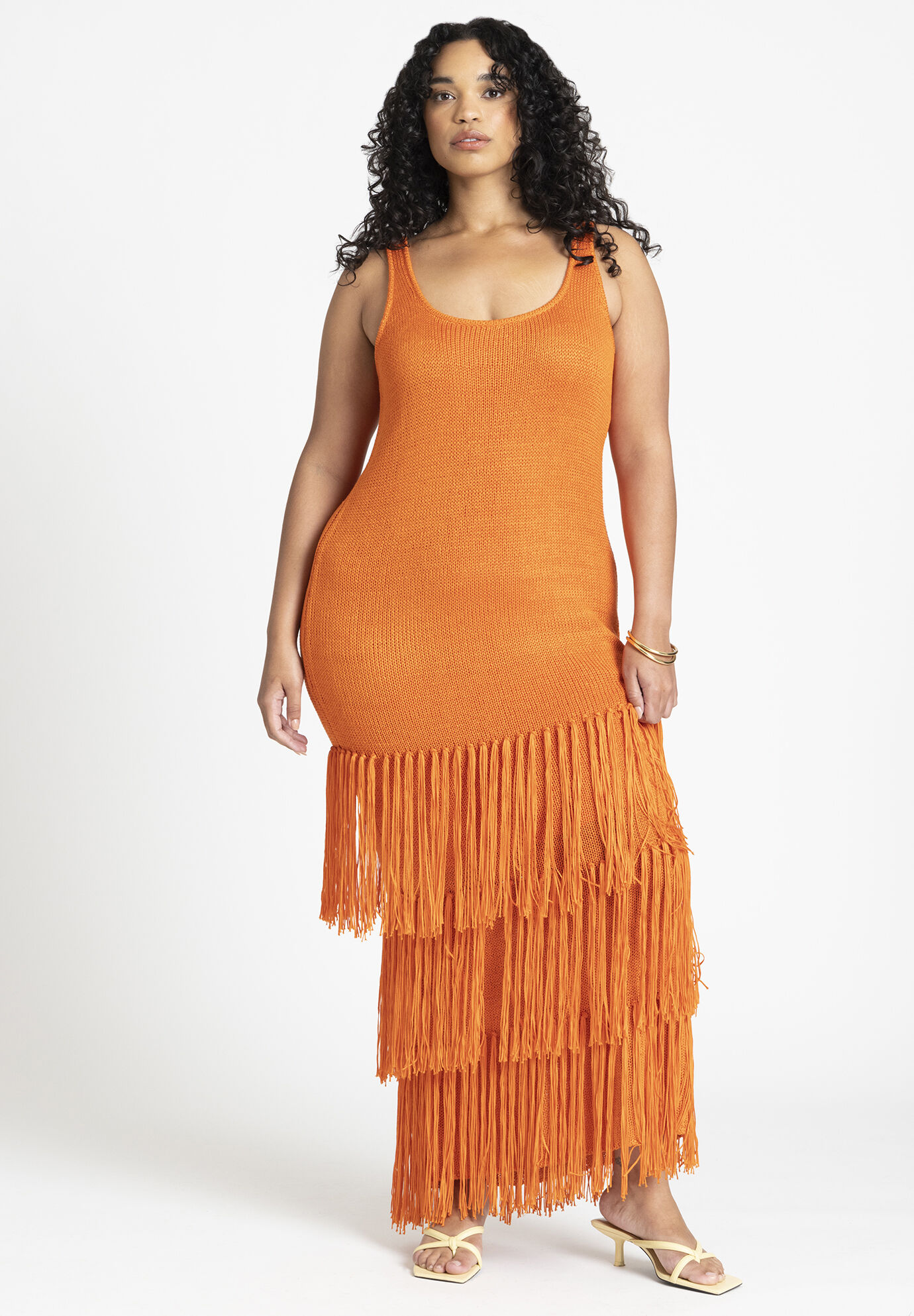 Eloquii orange tiered fringe beach dress.