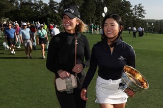 Rose Zhang of the United States celebrates with the trophy and Stanford teammate Rachel Heck after winning in a playoff during the final round of the Augusta National Women's Amateur at Augusta National Golf Club on April 01, 2023