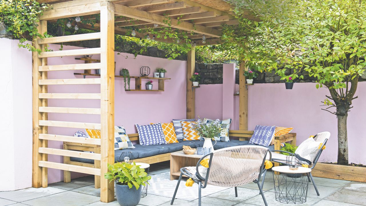 garden patio with outdoor seating area and pergola