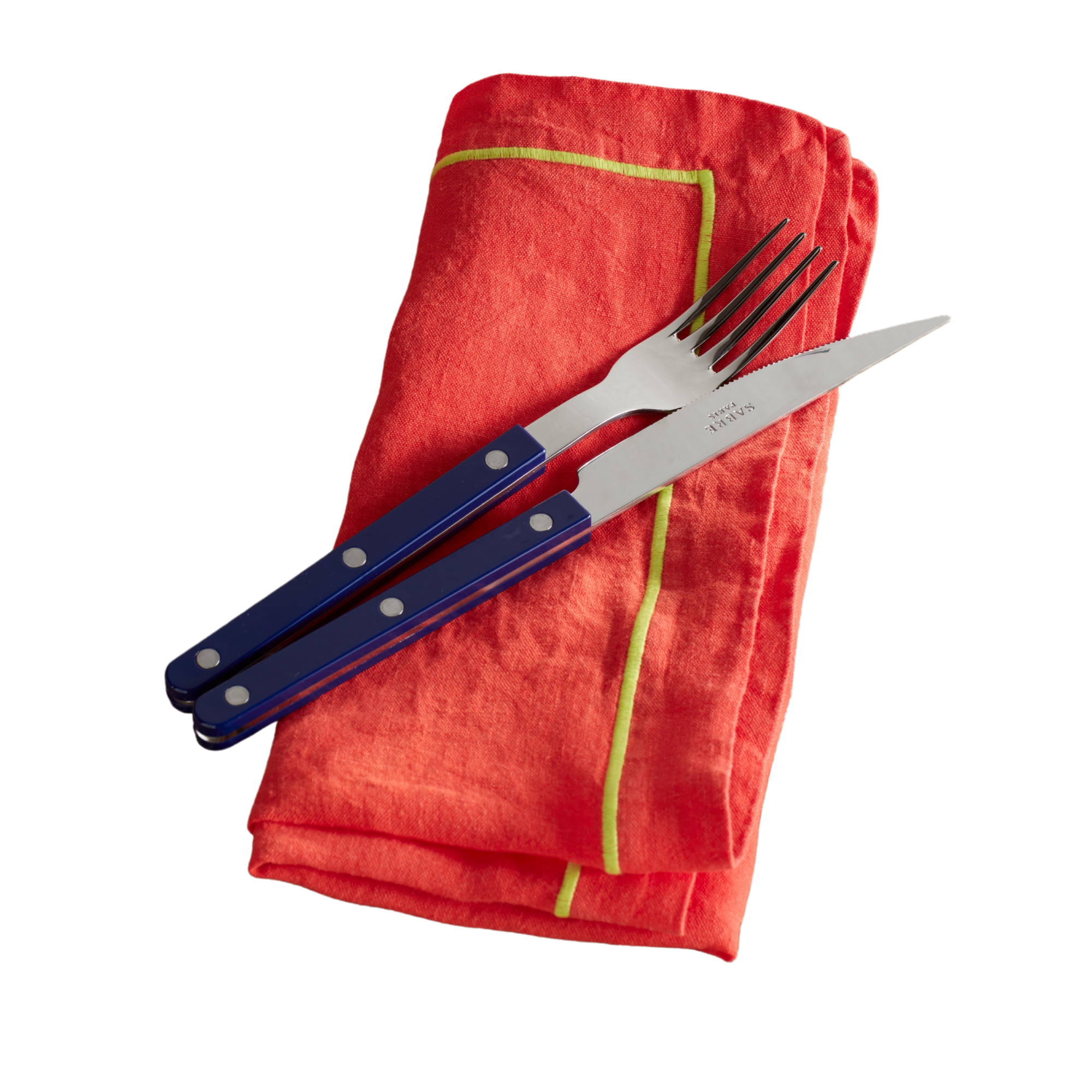 a red napkin with a light green border resting underneath a fork and a knife with a blue handle