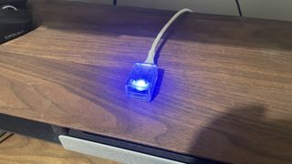 A Pulsar X2 CrazyLight Medium gaming mouse on a desk.