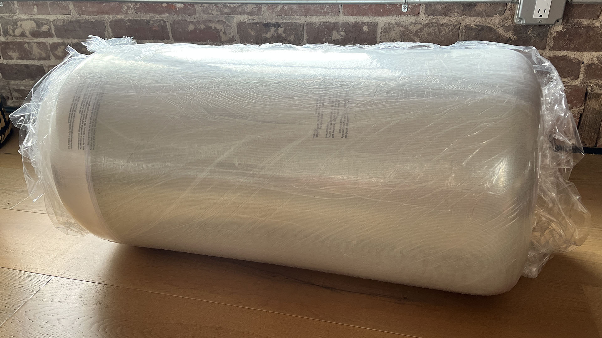 Layla Essential mattress vacuum-packed and rolled in plastic