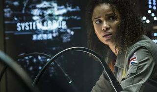 The Cloverfield Paradox Gugu Mbatha-Raw looks concerned in front of some equipment