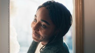 Ayo Edebiri smiling as Sydney in The Bear.