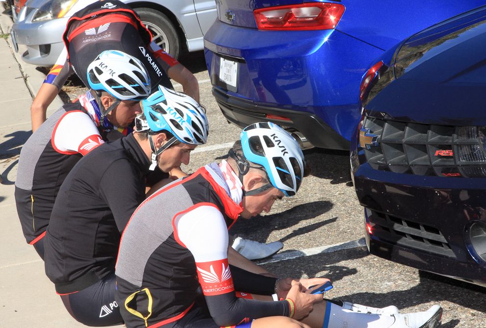 Riders check their phones at the top of Mt. Lemmon