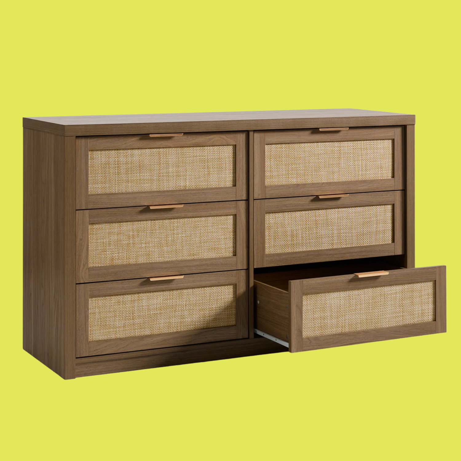 A rattan and dark wood chest of drawers with flat gold handles