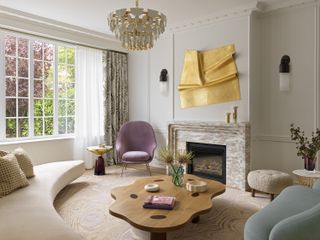 a living room with a curved coffee tables