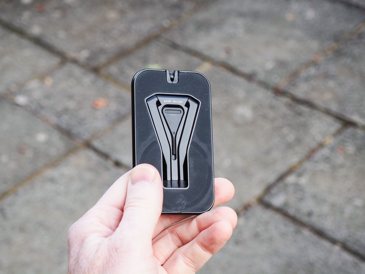 Peak Design Mobile Tripod folded away, in user's hand