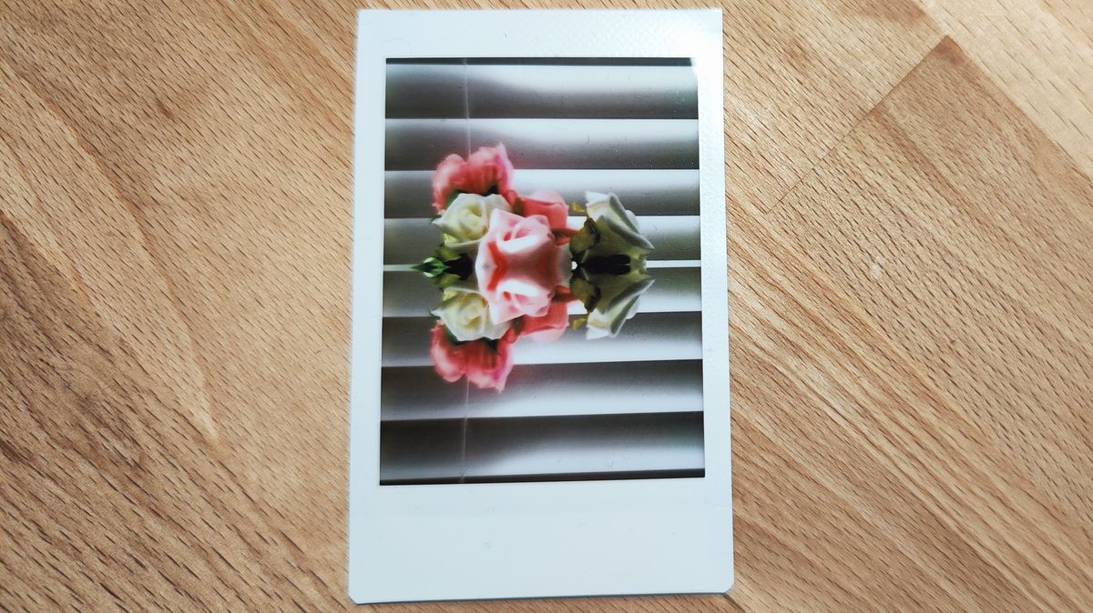 Instant photos on a wooden table