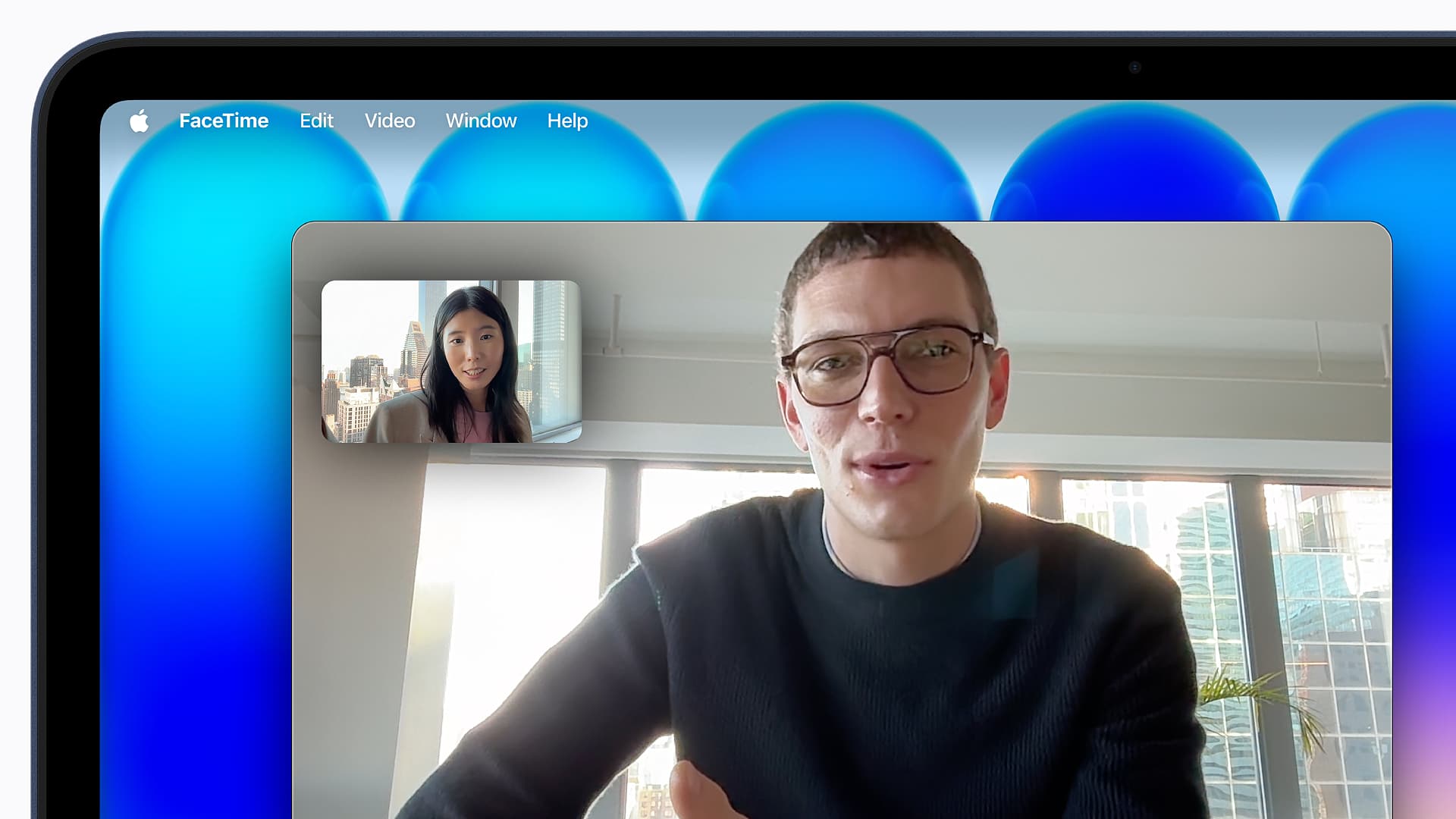 A person conducting a FaceTime call on an Apple MacBook Neo.