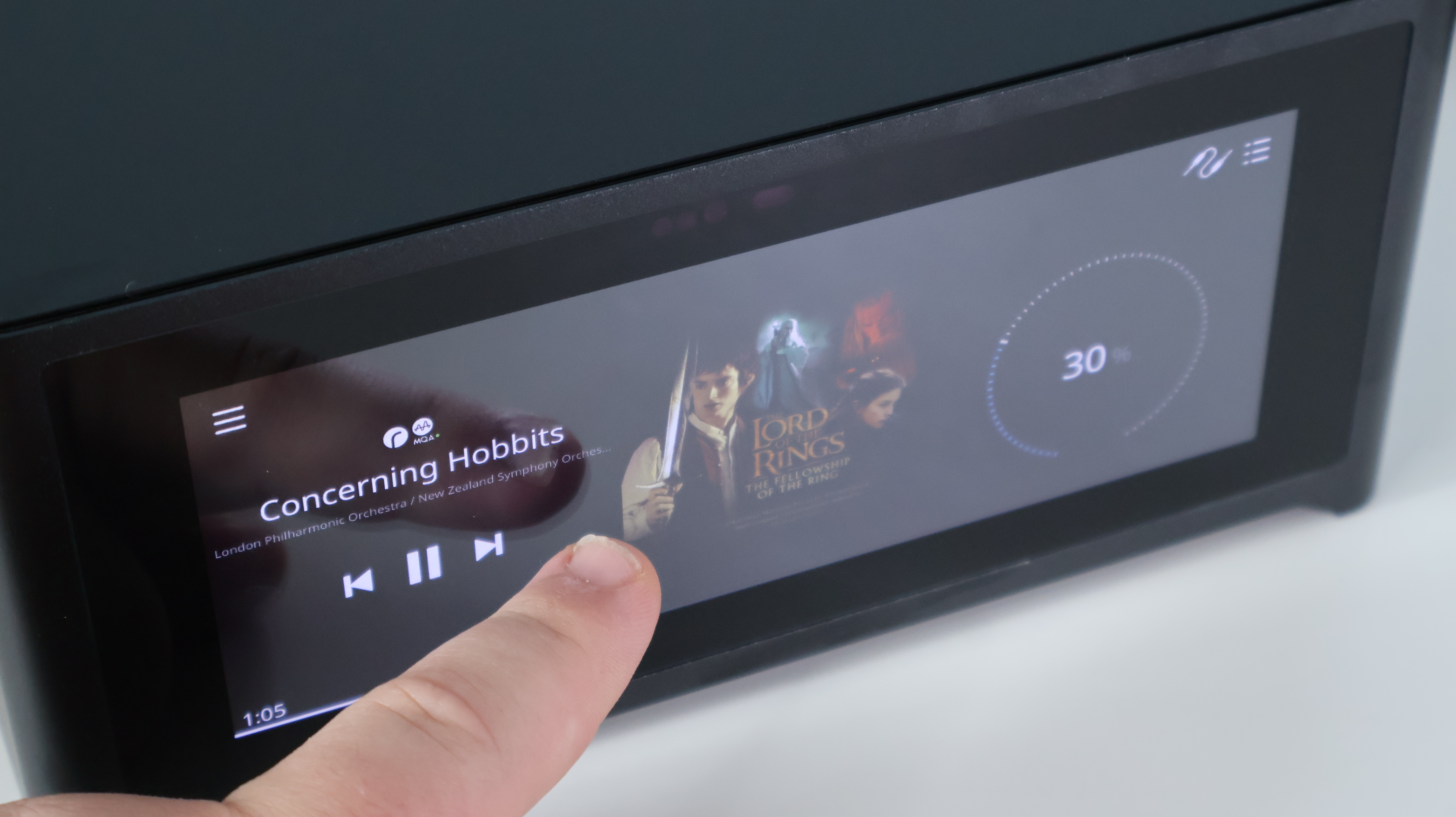 Person interacting with the NAD M10 V3 display