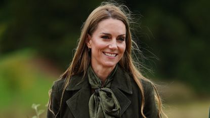 Catherine, Princess of Wales smiles as she presents "Go Wild" badges as she meets members of the Scouts' Squirrels programme