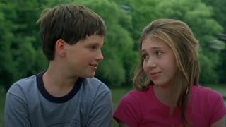 The two main stars talking in Central Park in Little Manhattan.