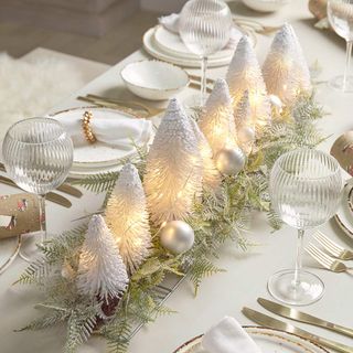 Christmas table decorations with white fantasy dorect centrepiece