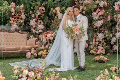 Caitlin (left) and Shannon (right) posing in a garden on their wedding day