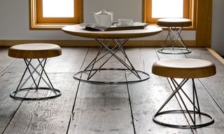 coffee table and stools on wooden floorboards