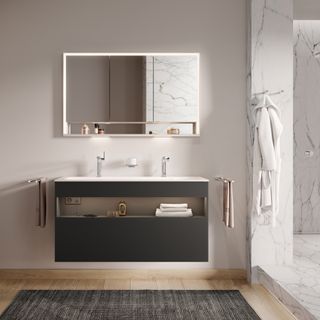 Modern bathroom with wall hung vanity unit with built-in lighting