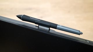 Stylus attached to the top of the XPPen Artist Pro 24 (Gen 2) 4K drawing tablet