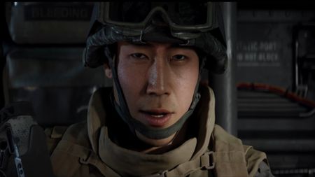 Playable character Private Park, a South Korean solider, sits in a helicopter in armored gear in Call of Duty Modern Warfare 4 
