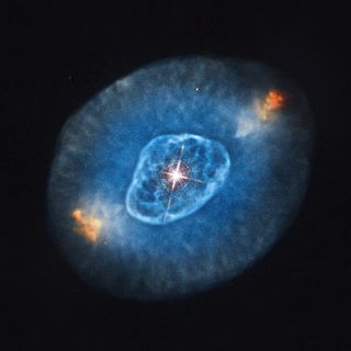 Optical emission of NGC 6826 from the Hubble Space Telescope is colored red, green and blue. This image was released Oct. 10, 2012.