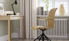 A minimalist home office with a rattan-inspired office swivel chair