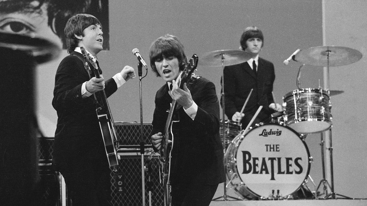 The Beatles during their final performance on THE ED SULLIVAN SHOW. Image dated August 14, 1965. Shown from left: Paul McCartney, George Harrison, Ringo Starr.