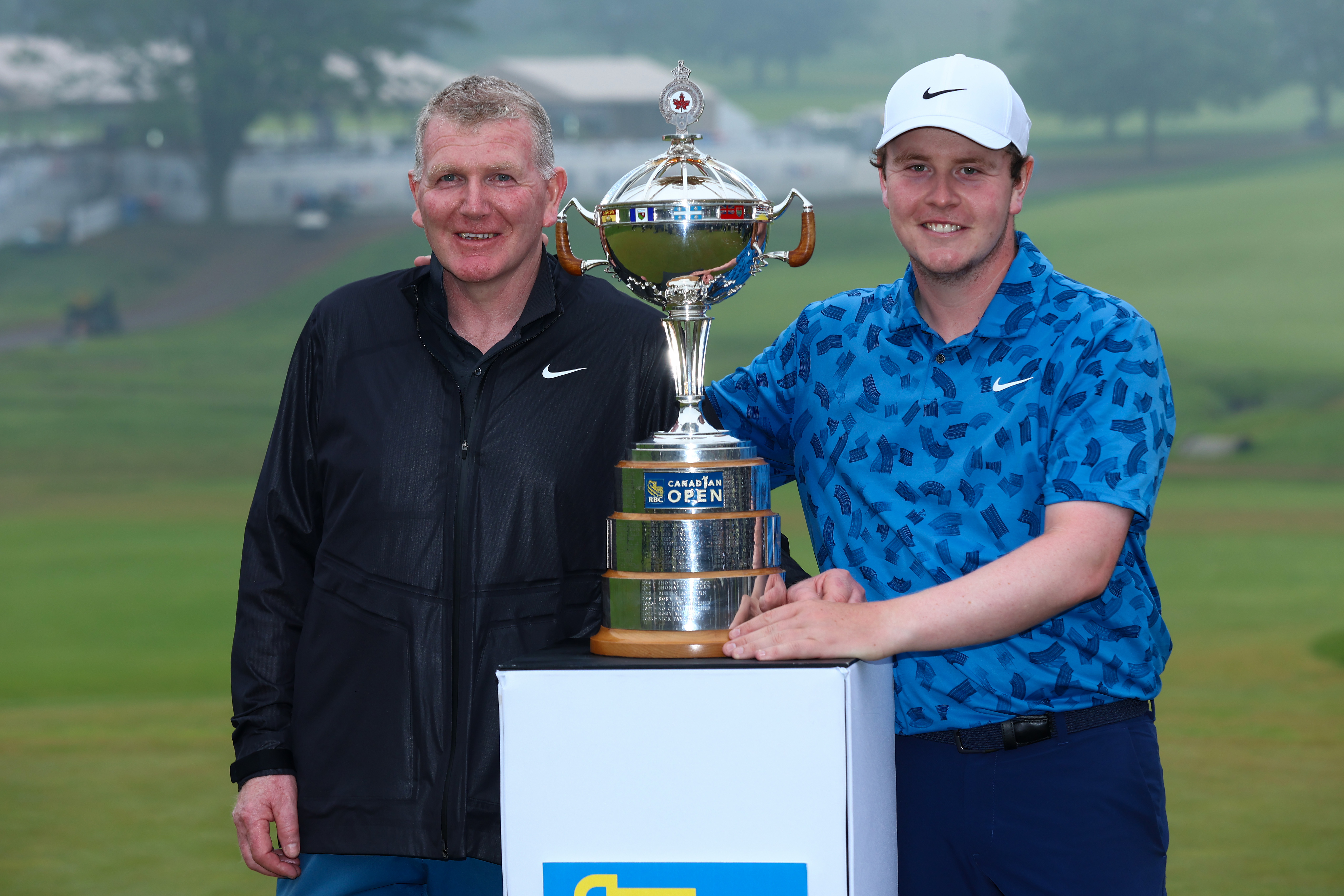 Dougie and Robert MacIntyre celebrate Robert's victory at the RBC Canadian Open