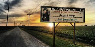 A billboard seeking leads in the case in Who Killed Garrett Phillips?
