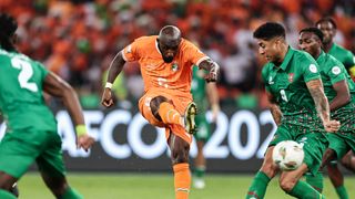  Ivory Coast's midfielder #6 Seko Fofana, wearing the national team's orange strip, strike the ball at the camera prior to the 