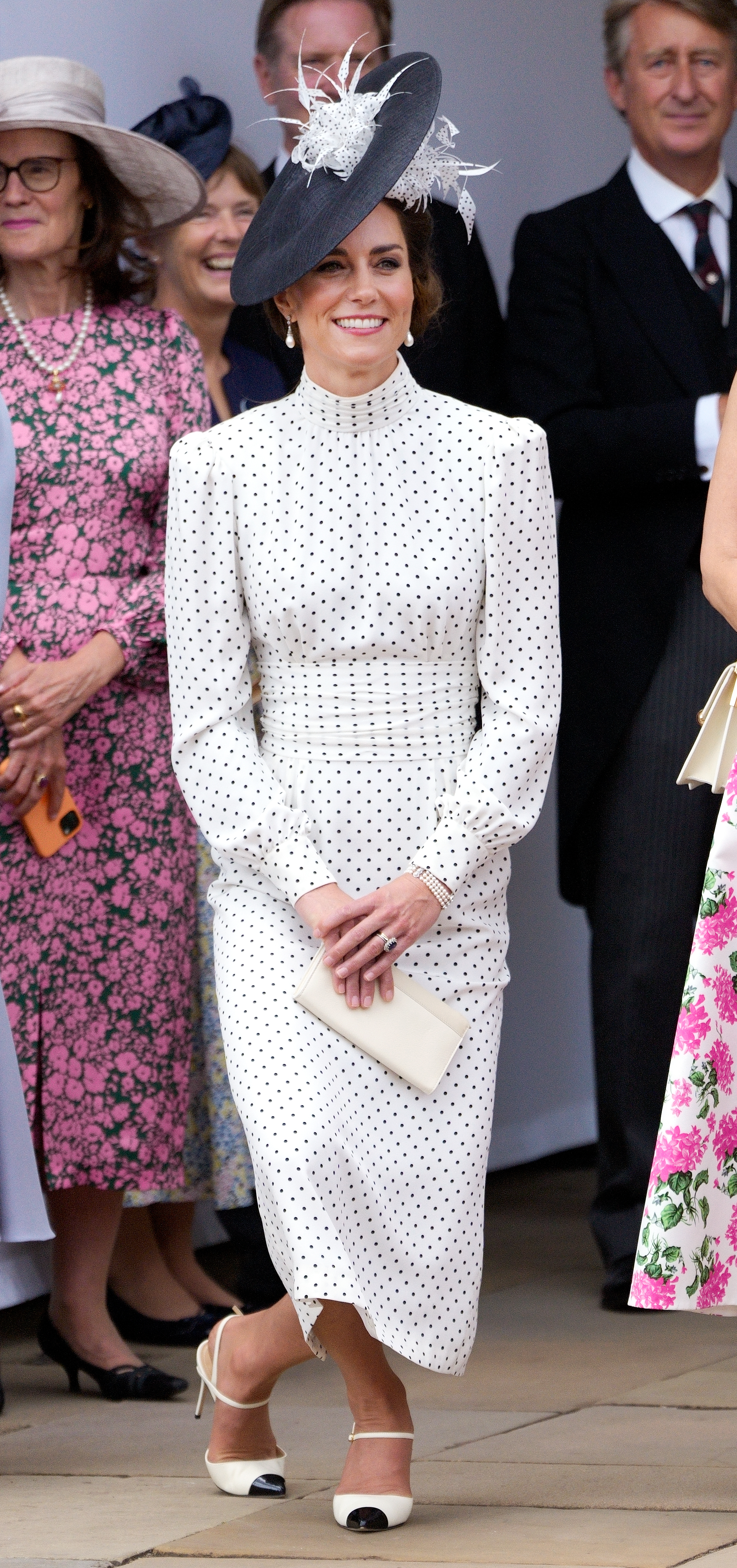 Catherine, Princess of Wales curtseys to King Charles III as she attends The Order of The Garter service