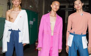 Per Götesson S/S 2018. models wearing pink suit, smart pants and various sweaters/shirts